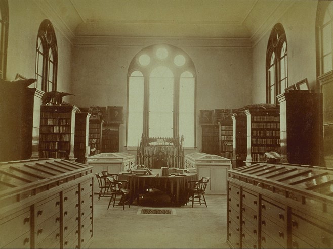 Interior, library in south wing, looking toward window (photo circa 1869-73)