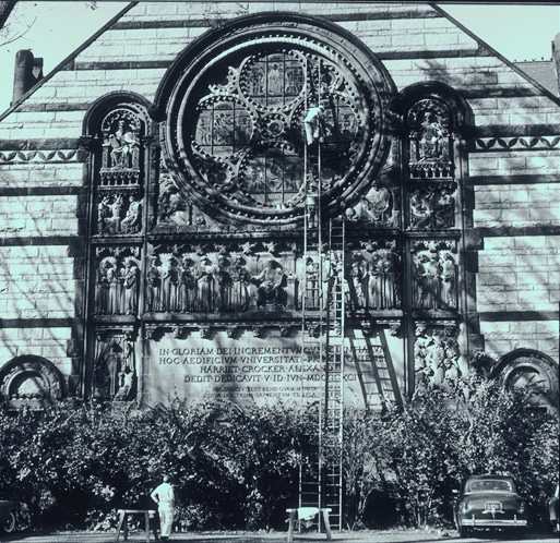 South facade, with workers cleaning window (photo 1940s or 50s)
