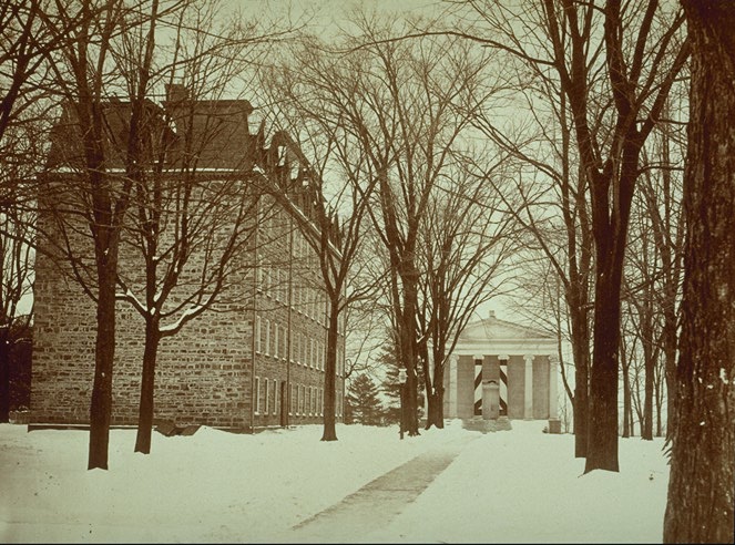 Distant view of the facade of the original structure from the north, with East College at left (photo c.1886)