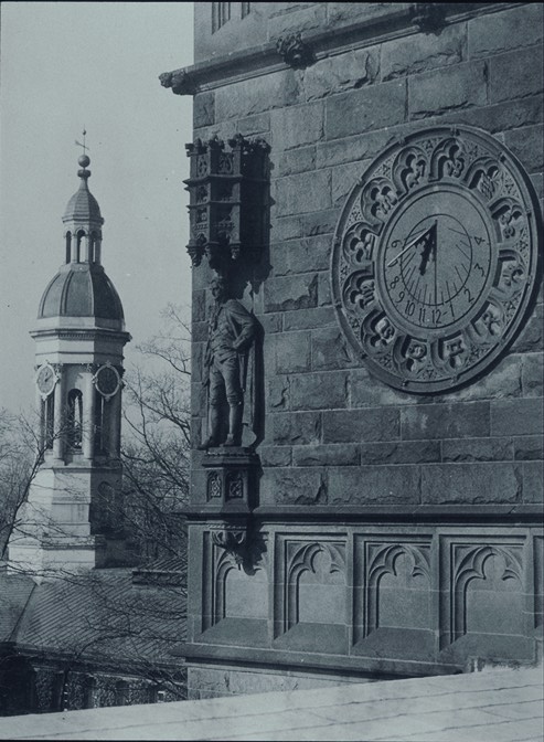 Sundial and statue of James Madison on south face of tower